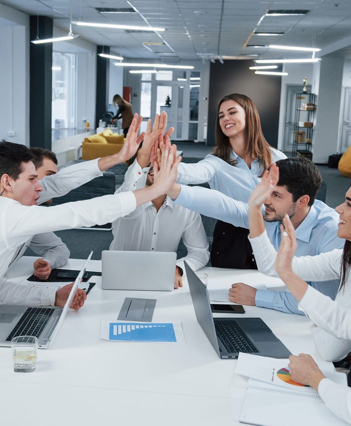 Cheerful business people. Job is done. Group of office workers happy to hit their own records and being successful.